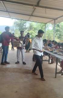 Volunteers serving people during a food donation activity